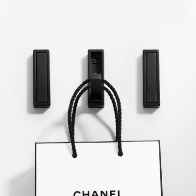 Patere-rabattable-design-noir-sac-suspendu