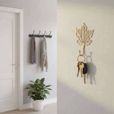 clés suspendues sur porte clef mural forme feuille érable dorée