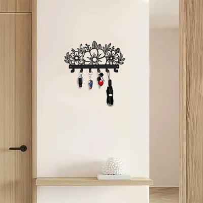 clés accrochées sur porte manteau fleurs noir