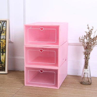 trois boite a chaussure plastique rose empilées cadre peinture 
