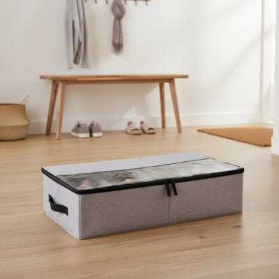 boite a chaussure tissu gris clair sur sol entrée maison