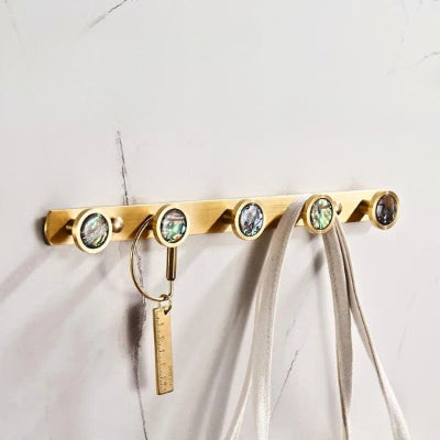 porte manteau doré boutons irisé noir