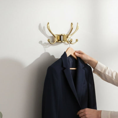 porte manteau mural doré crochets pivotants élégant