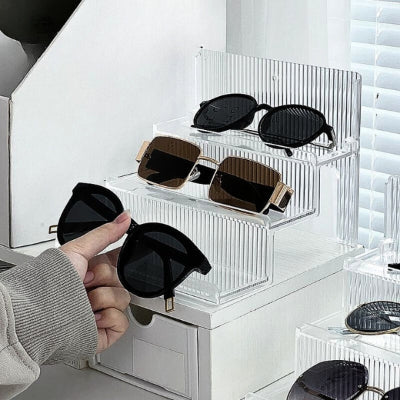 main prend lunettes soleil présentoir à lunettes transparent trois niveaux