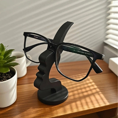 presentoir lunettes artistique profil visage noir plante verte