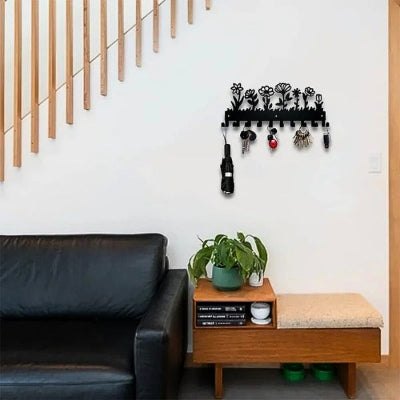 canapé noir console bois porte clé mural fleurs métal noir