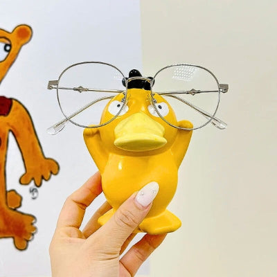 main tient support de lunettes canard jaune